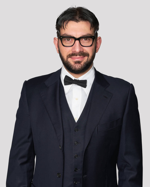 happy handsome man wearing classic suit and bow tie - Фото, изображение