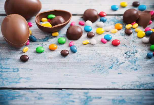 Chocolate Easter Eggs Over Wooden Background - Fotografie, Obrázek