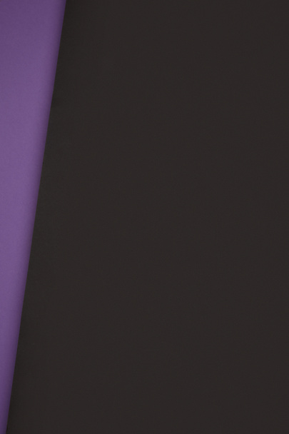dark black and violet geometric background from colored paper - Foto, immagini