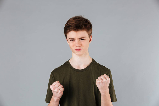 Portrait of a happy male teenager wearing t-shirt - Zdjęcie, obraz