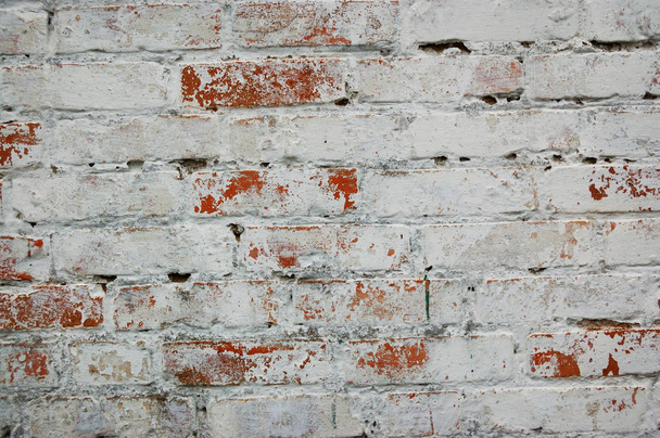 Old ruined painted white brick wall background - Fotó, kép