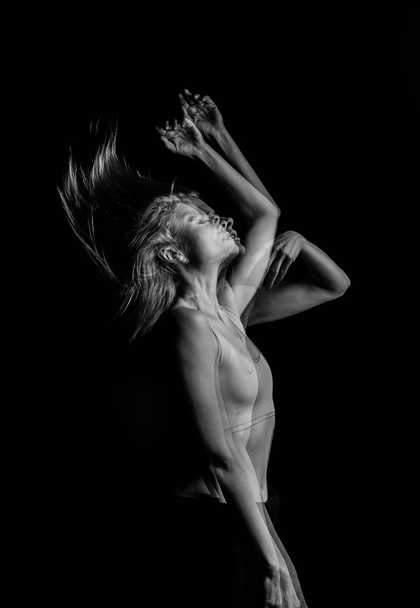 creative original portrait of the girl throws up her hair. movement effecttriple Multiple exposure black and white photo - Fotoğraf, Görsel
