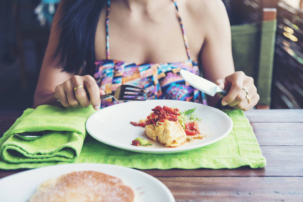 women black hair having breakfast morning time - Фото, изображение