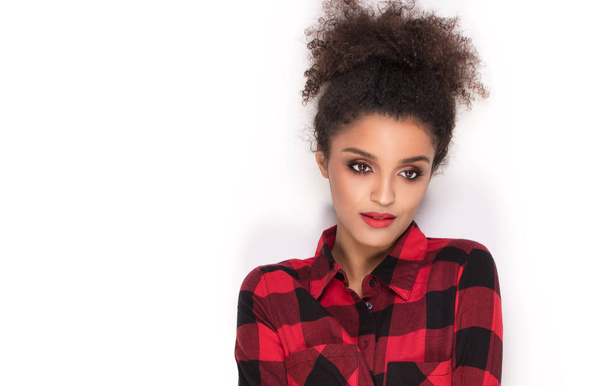 Afro girl in red checkered shirt. - Foto, immagini