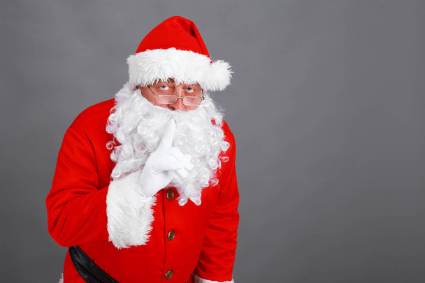 Real Santa Claus carrying big bag full of gifts, isolated on white background - Zdjęcie, obraz