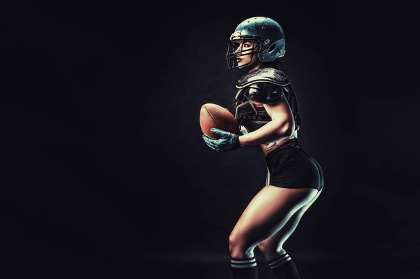Competitive woman with rugby ball - Foto, imagen