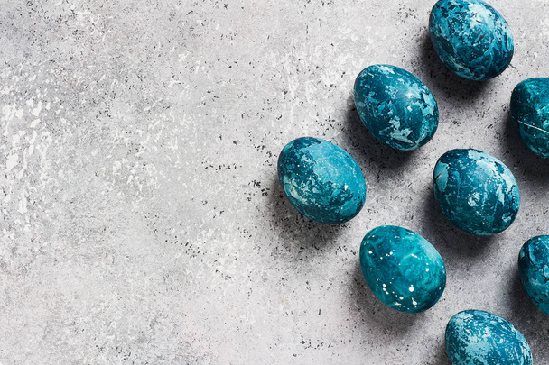 Easter eggs painted by hand in blue color on light background - Φωτογραφία, εικόνα