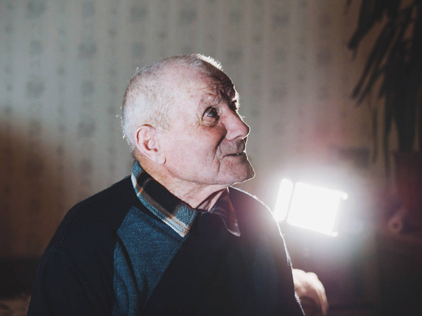 Very old man portrait. Grandfather. Aged, elderly, loneliness, senior with a small number of teeth. Face of man sitting alone. - Фото, изображение