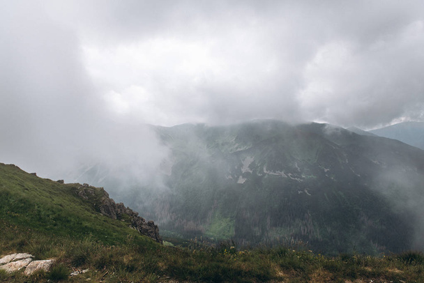 Foggy and cloudy mountains scenery in Tatry - Fotó, kép