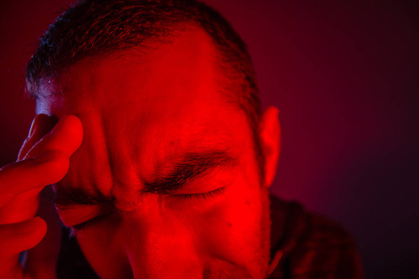 Man is suffering in pain from headache - Fotografie, Obrázek