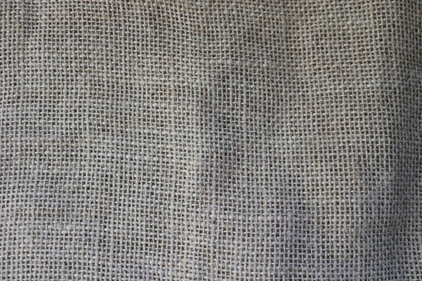 Textura de tela vieja marrón, material natural de lino con un entrelazado perpendicular grueso de las fibras de la tela. El trasfondo
. - Foto, imagen