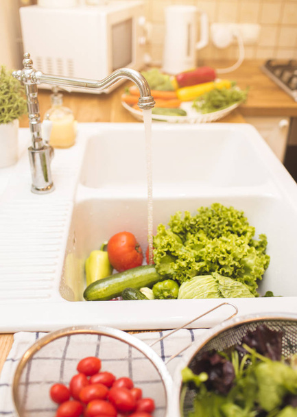 Vegetables lie in the sink - Photo, Image