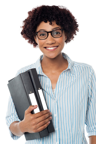 Bespectacled woman in casuals holding files - Photo, Image
