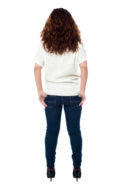 Back view of a long haired woman over white - Fotoğraf, Görsel
