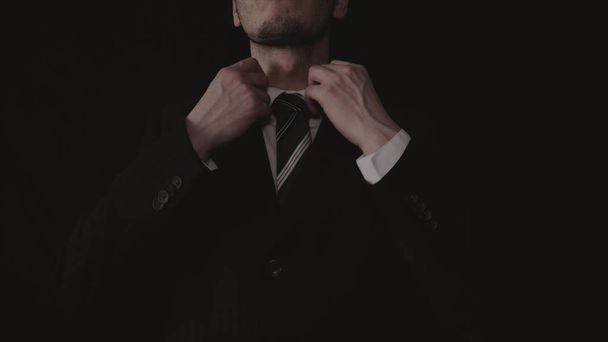Businessman in suit, black background. - Fotografie, Obrázek