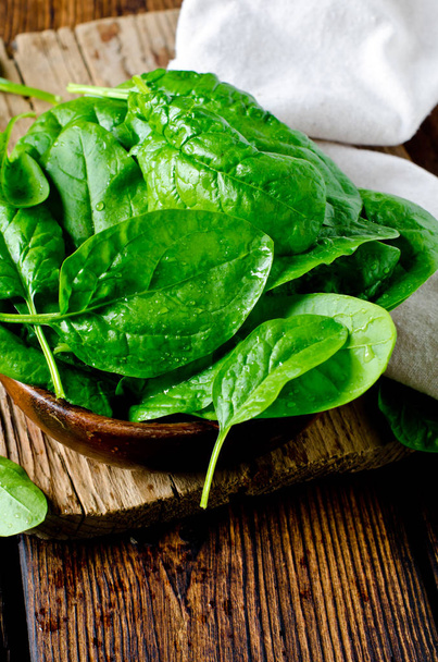 Fresh spinach on a cutting wooden board - Photo, Image