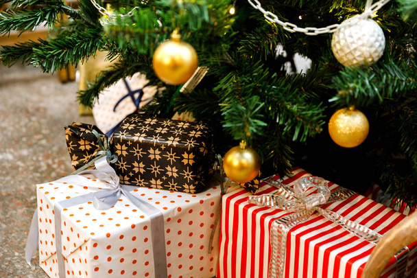 Christmas giftboxes under the tree - Photo, Image