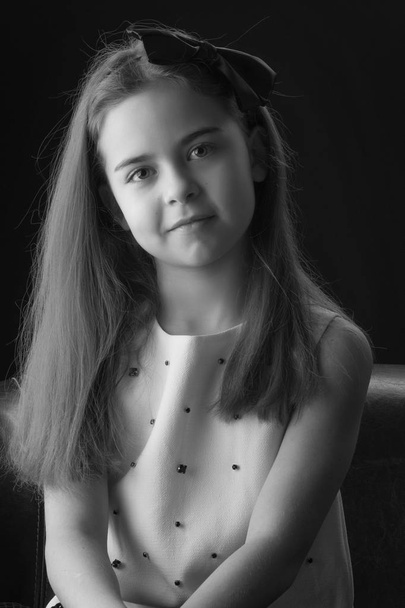 Little girl on a black background - Fotó, kép