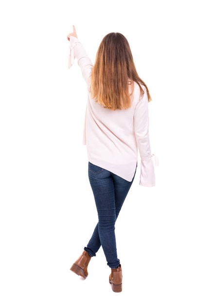 Woman posing with her back faced to camera, isolated over copy space background - Photo, Image