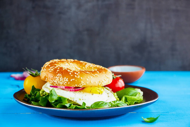 Bagel with egg and vegetables - Photo, image