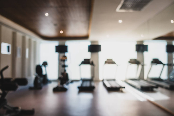 Abstract blur and defocused fitness equipment in gym interior - Φωτογραφία, εικόνα