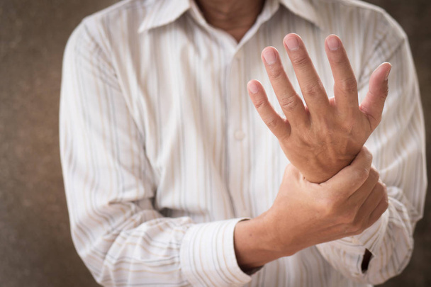 senior man suffering from wrist carpal tunnel syndrome cps or injury, old man with osteoporosis, arthritis, injury, inflammation, gout, rheumatoid symptoms - Photo, Image