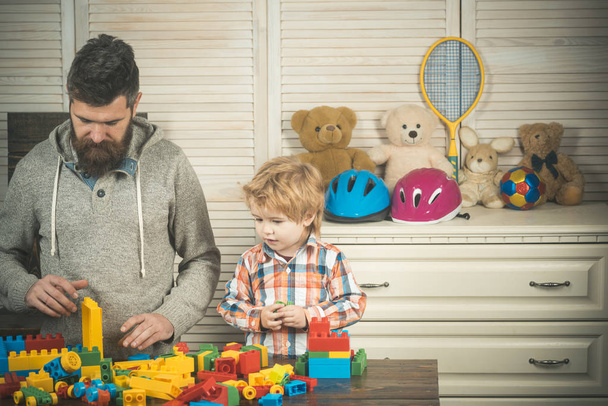 Family play with construction plastic blocks. Father and son play - Photo, image