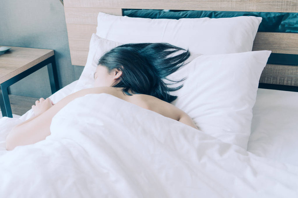 women sleep in white pillow on bed - Zdjęcie, obraz