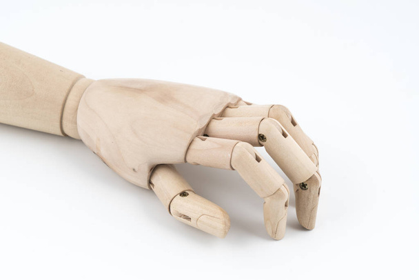 the gesture with a jointed wooden hand - Фото, изображение