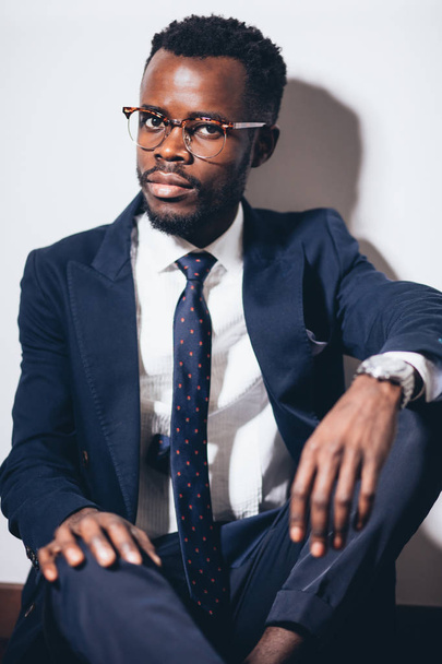 business man with glasses in jacket and tie looks away - Fotó, kép