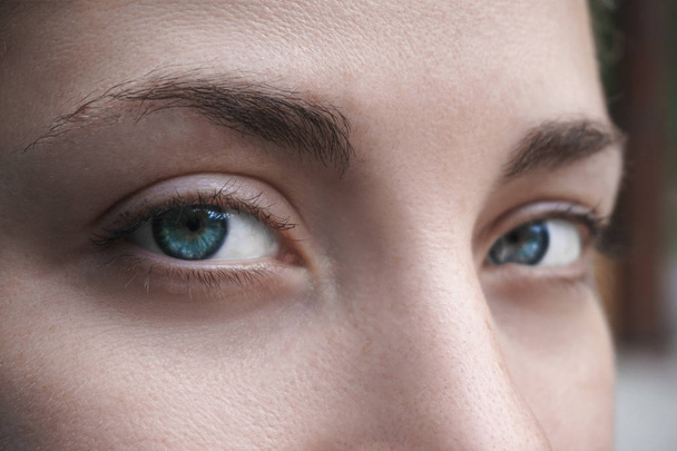 Closeup of young beautiful woman eyes - Foto, imagen