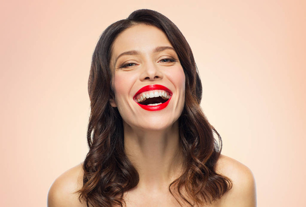 beautiful laughing young woman with red lipstick - 写真・画像