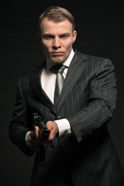 Mafia man with gun. - Фото, изображение