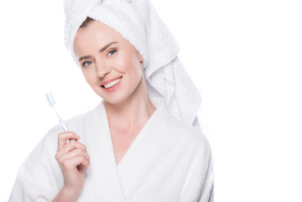 Smiling woman with clean skin holding toothbrush isolated on white - Valokuva, kuva