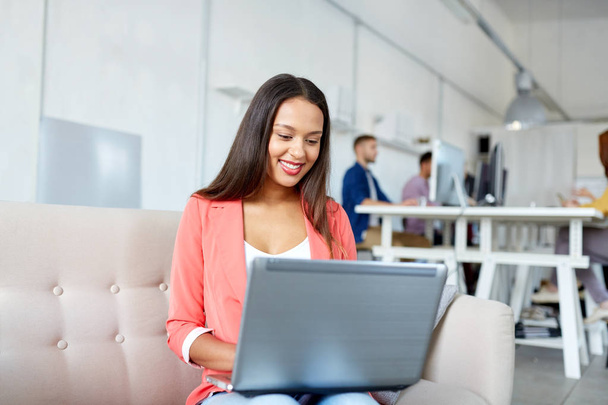 happy woman with laptop working at office - Zdjęcie, obraz