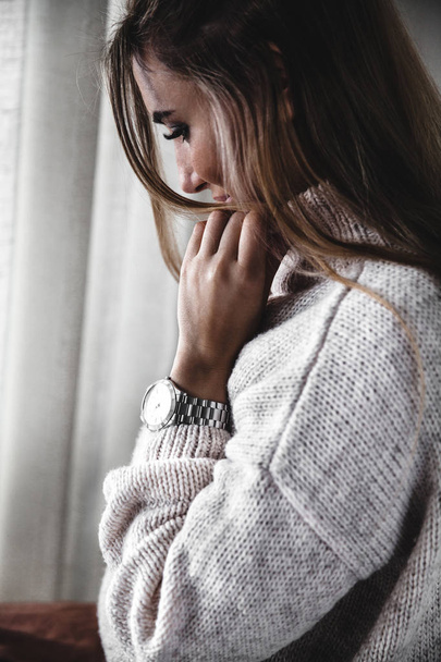 Beautiful young woman in warm sweater - Фото, зображення
