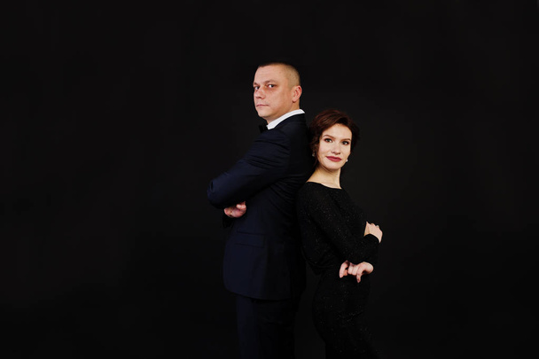 Elegance woman in black evening dress with man in suit posed on  - Foto, Imagem
