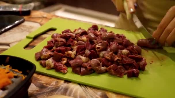 Chopping chicken hearts. Preparation of a bird. - Footage, Video