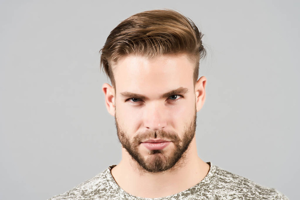 Guy with bearded face, stylish hair, haircut, barber salon - Foto, afbeelding