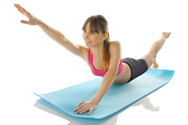 Young fitness woman doing pilates exercise - Φωτογραφία, εικόνα