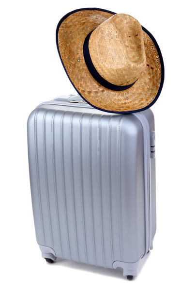Silver suitcase with woman's hat isolated on white - Foto, Imagen