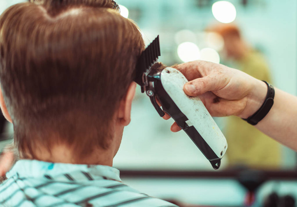 Haircut at the beauty salon. Hair care. Closeup. Soft focus. - Фото, изображение