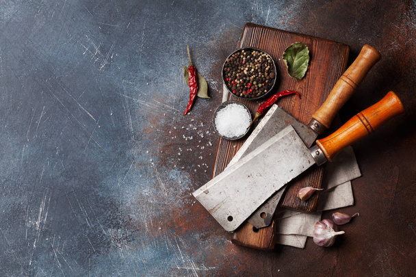 Butcher. Vintage meat knives and spices over cutting board. Top view with space for your text - Фото, зображення