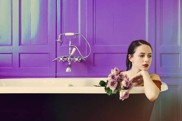 young woman in bath with flowers - Zdjęcie, obraz
