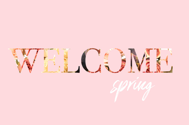 WELCOME SPRING sign cut out of floral bouquet photo on pink - Foto, Imagen