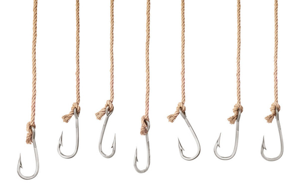 Set of fishing hooks on the ropes isolated on a white background. 3d illustration - 写真・画像