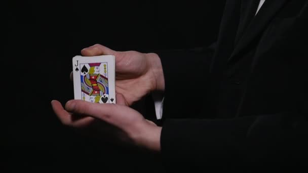 magic, card tricks, gambling, casino, poker concept - man showing trick with playing cards - Filmati, video