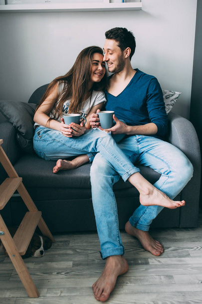A photo session of a guy and a girl in a cozy home environment. - 写真・画像