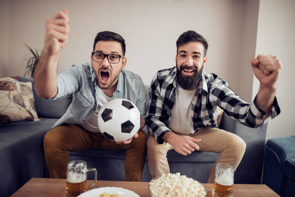Watching the big game!Sport,people, leisure, friendship and  happiness concept. - Photo, Image