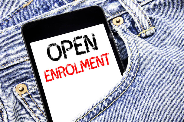 Handwriting Announcement text showing Open Enrolment. Business concept for Medicine Doctor Enroll Written phone mobile phone, cellphone placed in the man front jeans pocket. - Photo, Image